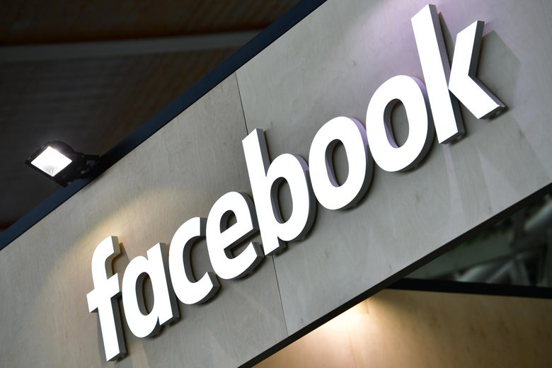 The Facebook logo is displayed on a sign.